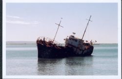 Old ship broken down ship in the bay in Black river Jamaica by Rebecca April 